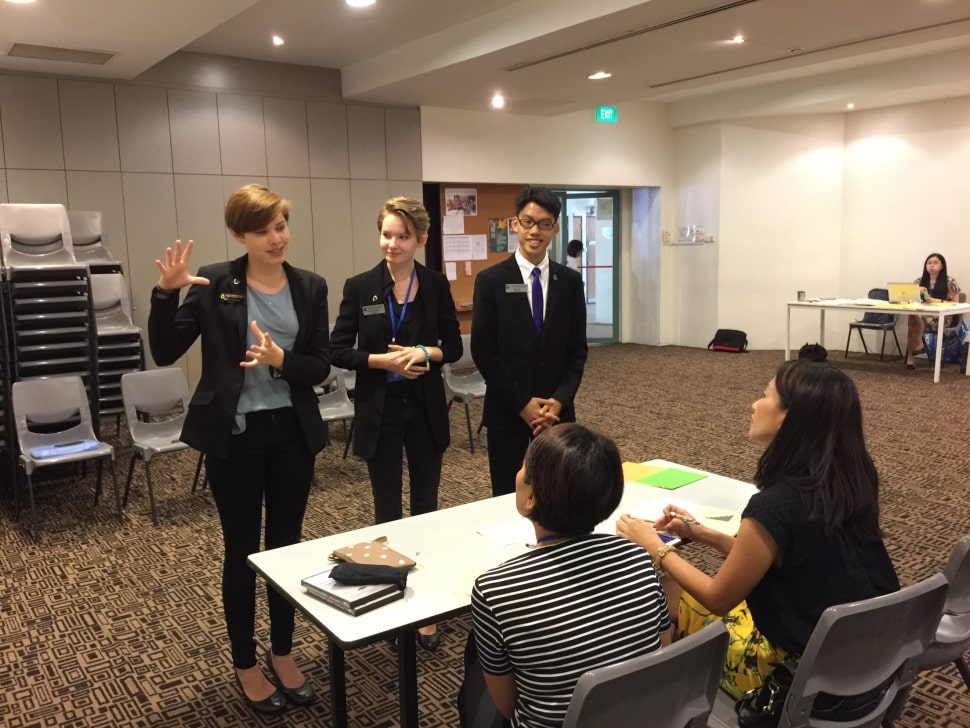 3 students giving a speech together